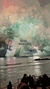 a fireworks display in jeddah saudi arabia with people watching