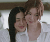 two women are hugging each other with the words lingormgifss on the bottom right
