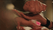 a close up of a person 's hand with the word jic on the bottom