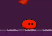 a red square with a white border is sitting on a purple surface in a video game .
