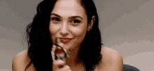Gal Gadot And Her Toy Of Wonder Woman GIF - Gal Gadot And Her Toy Of Wonder Woman GIFs
