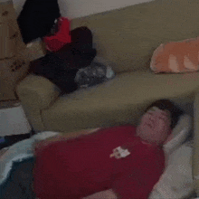 a man in a red shirt with the letter b on it