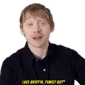 a man in a black shirt is making a funny face and says louis griffin family guy .