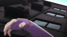 a hand in a purple glove is reaching for something