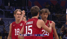 a basketball player wearing a red jersey with the number 15 on the back