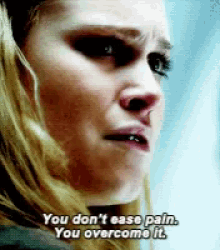 a close up of a woman 's face with the words you do n't ease pain you overcome it