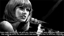 a black and white photo of a woman singing into a microphone with the words every single second that i am with you