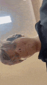 a close up of a person 's face with their eyes closed and their mouth open .