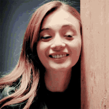 a close up of a woman 's face with a smile on her face