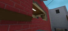 a brick wall with a person holding a gun behind it