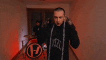 a man with a scarf around his neck that says a-z