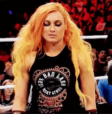a woman wearing a tank top that says bad labs on it