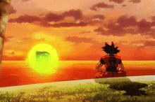 a cartoon of goku sitting on a beach watching the sun set