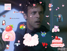a man is surrounded by pink stickers including a cake and a strawberry