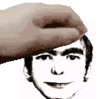 a hand is touching the forehead of a man .