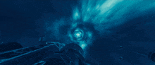a person is flying through a blue tunnel