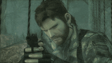 a man with a beard is holding a gun with bullets in it