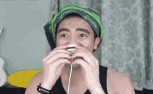 a man with a bandana on his head that says ' o'eye '