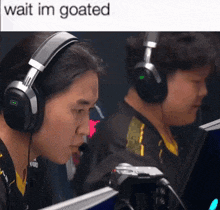 a man wearing headphones looks at a computer screen with a caption that says " wait im goated "