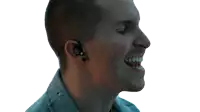 a man wearing a pair of ear buds with a key on them