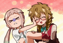 a girl with a skull on her head is holding another girl