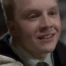 a close up of a man 's face with his mouth open
