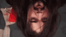 a close up of a person 's face with blood on it