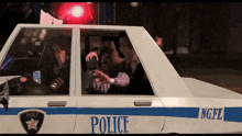a police car with the letters ngfl on the side