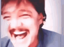 a man with a mustache is laughing with his mouth open in a blurry photo .