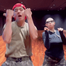 a man and a woman are dancing together and the man is wearing a hat that says supreme