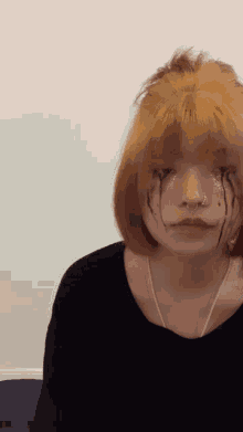 a girl with tears coming out of her eyes