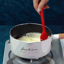 a pot that says fashion happy at easy is on a stove