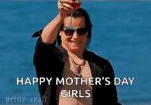 a shirtless man is holding a glass of wine and says happy mother 's day girls
