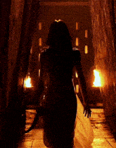 a woman in a white dress is holding a knife