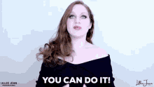a woman is making a gesture with her hands and says `` you can do it '' .