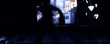 a blurry picture of a person standing in the dark