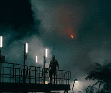 a man standing on a bridge with the word kepler on the bottom of the image