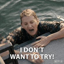 a woman in the water with the words i don t want to try