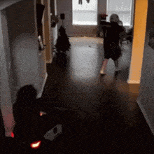 a person in a black shirt with the number 1 on it is running in a hallway