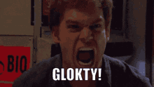 a man with his mouth wide open and the word glokty written on his face