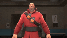 a man in a red jacket is holding a pair of gloves on his chest
