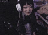a woman wearing headphones has the username ruuna_070
