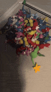 a bunch of stuffed animals are laying on a floor