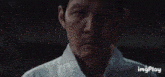 a close up of a man 's face with the words we are not horses on it