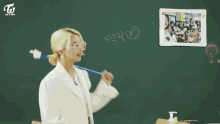 a girl with blonde hair is wearing a white shirt and a plaid tie