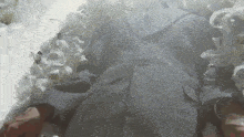 a man in a suit is laying in a coffin
