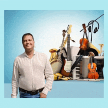 a man in a white shirt stands in front of a bunch of musical instruments