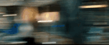 a blurry picture of a room with a few lights on