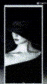 a black and white photo of a woman wearing a black hat
