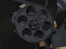 a close up of a person 's finger holding a gun